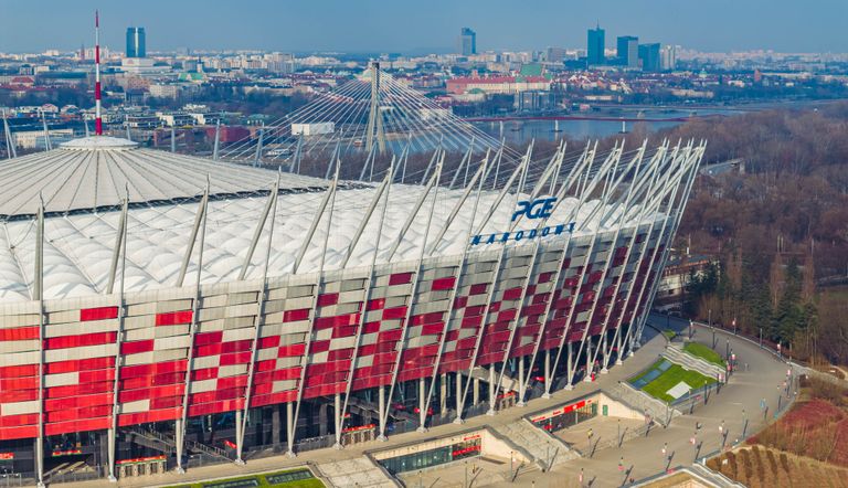 Stunning aerial shot of PGE Narodowy, showcasing Warsaw's iconic sports stadium and cityscape.